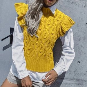 Cable knit ruffle trim sweater vest